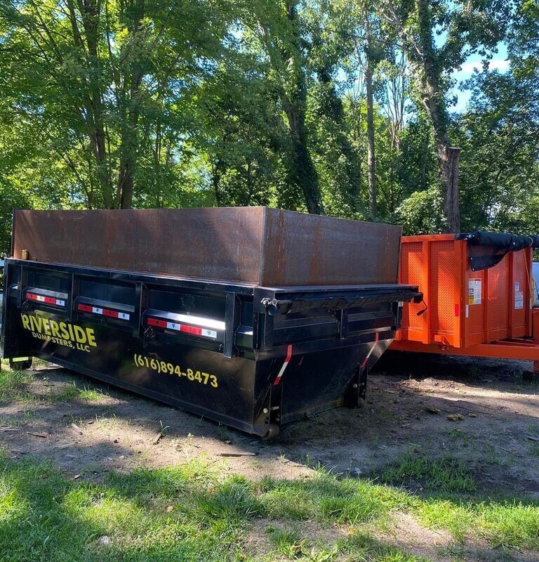 21 yard roll-off dumpster in yard and ready for use